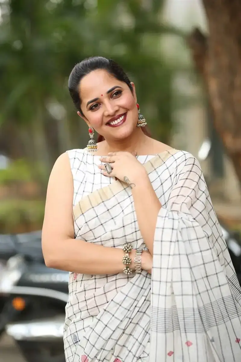 Anasuya Bharadwaj in White Saree at Razakar Movie Launch